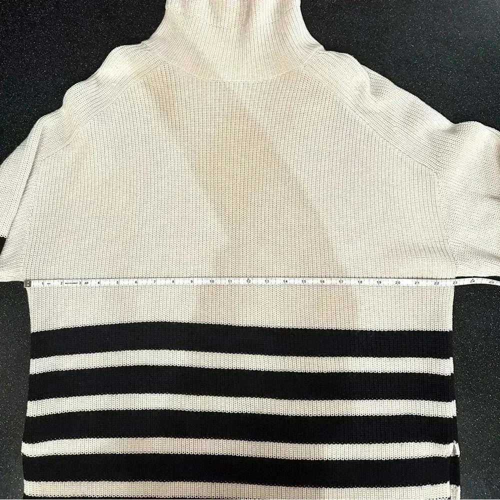 COS Roll neck sweater in white and black striped wool and cotton blend